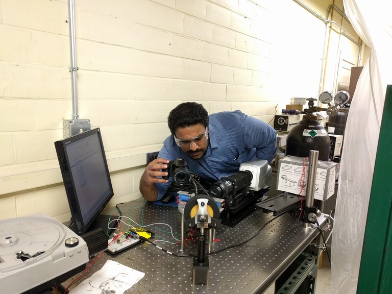 Researcher working on droplet project