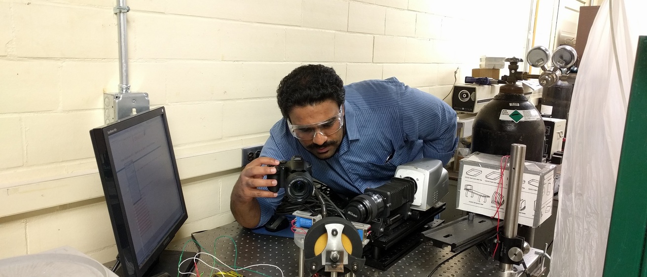 Researcher working on droplet project